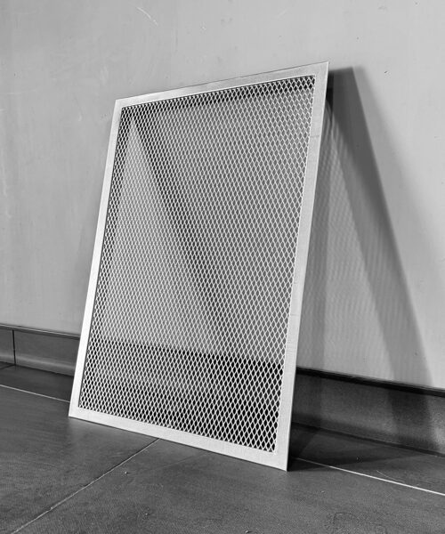 Rectangular grille with decorative mesh